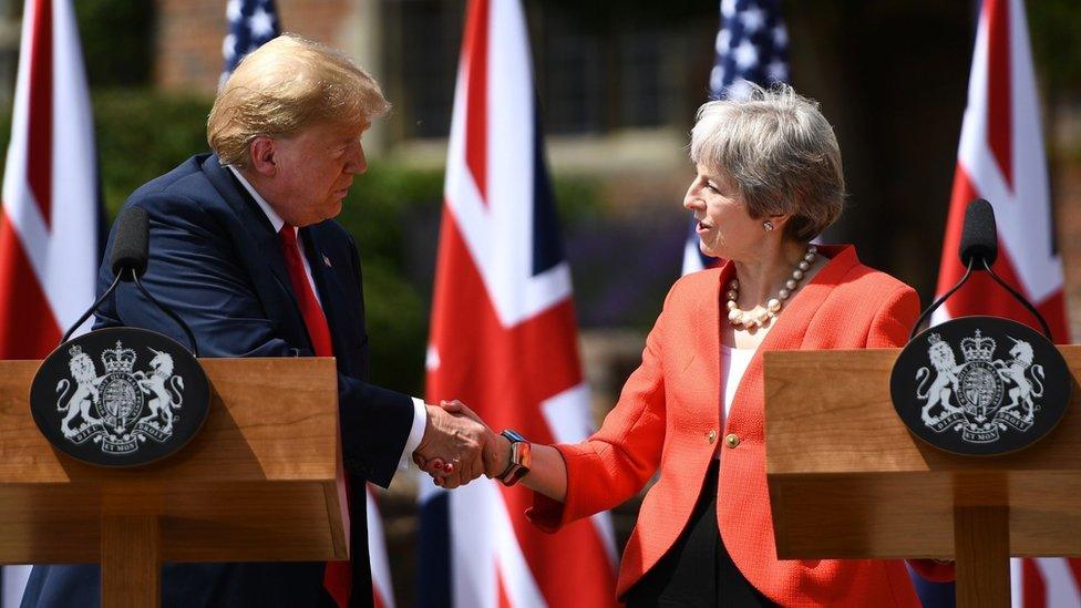 Donald Trump and Theresa May shake hands at a joint press conference during the president's visit to the UK in July last year