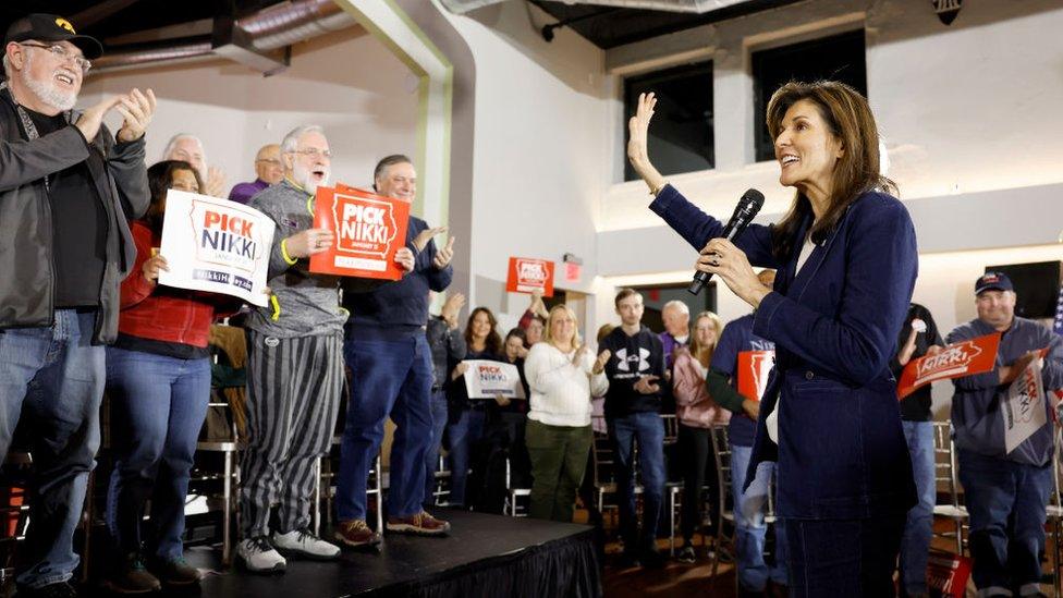 Republican presidential candidate former UN Ambassador Nikki Haley waves as she arrives to a campaign event at the Olympic Theater on January 11, 2024 in Cedar Rapids, Iowa