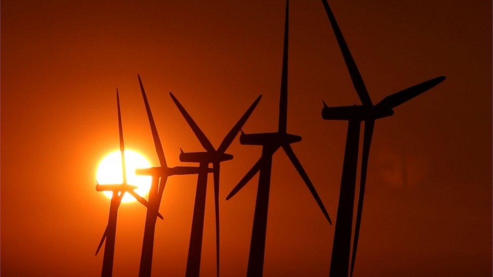 Sun setting over wind turbines near Faringdon, Oxfordshire