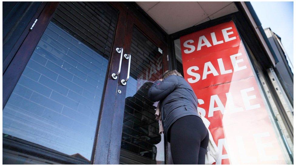 Exterior shot of Shaws store with a Sale sign