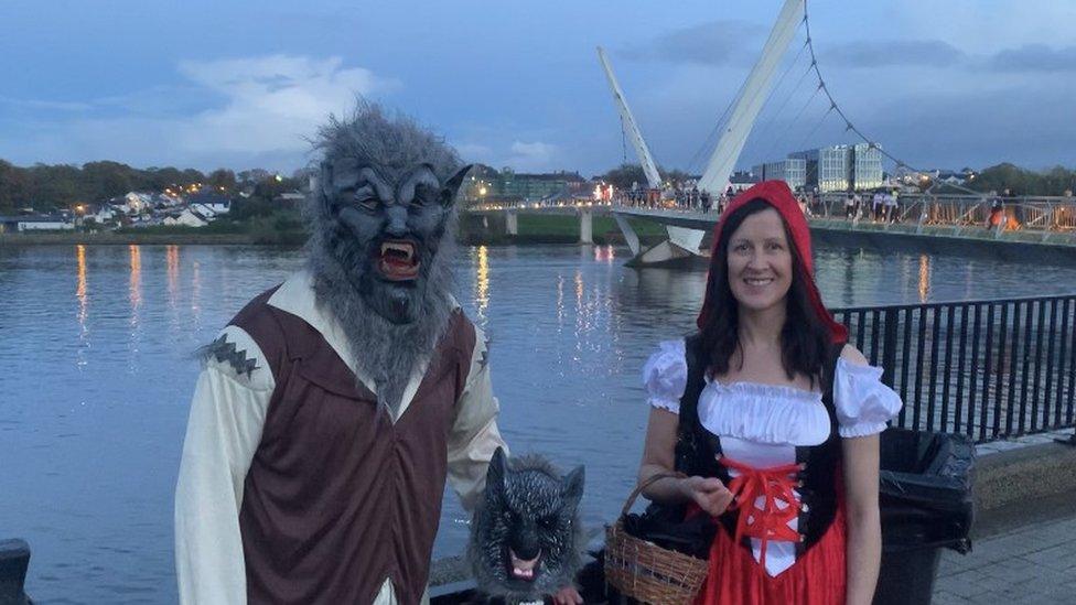 People in costume near the River Foyle