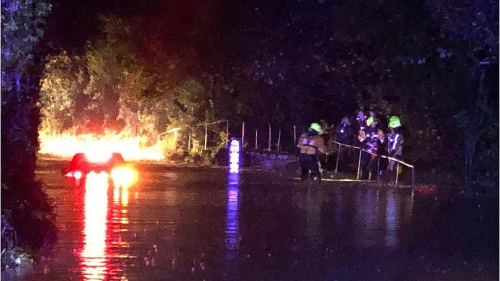 Car stuck in floodwater