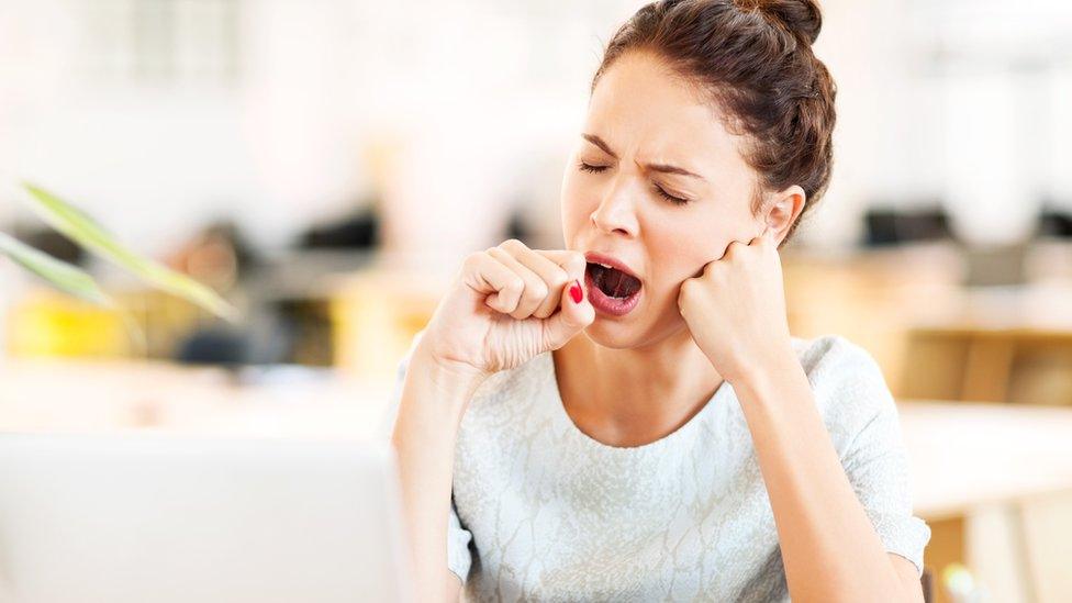 Woman yawning