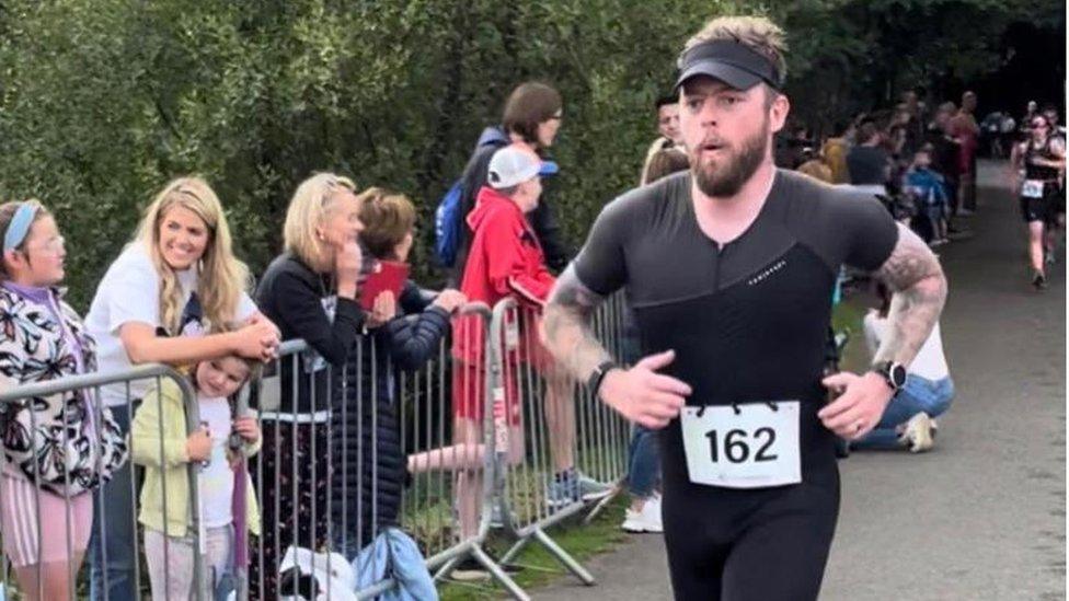 John McDermott running in triathlon