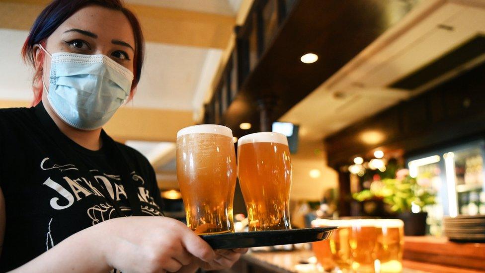 Serving pints in a pub