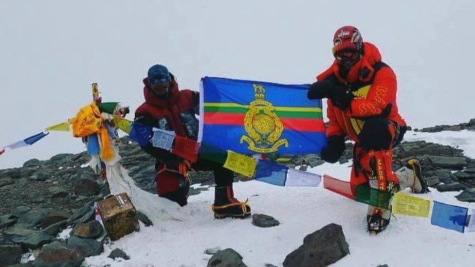 Mr Deen at summit of a mountain