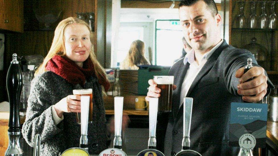 Tenants Madeline Carter and Warren Machell behind the bar