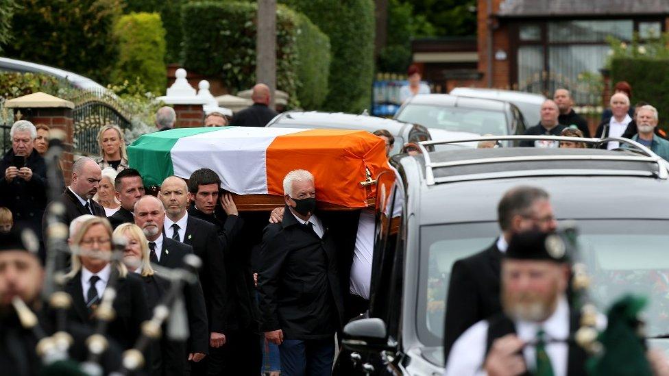 Mourners carry Bobby Storey coffin ahead of his funeral in west Belfast