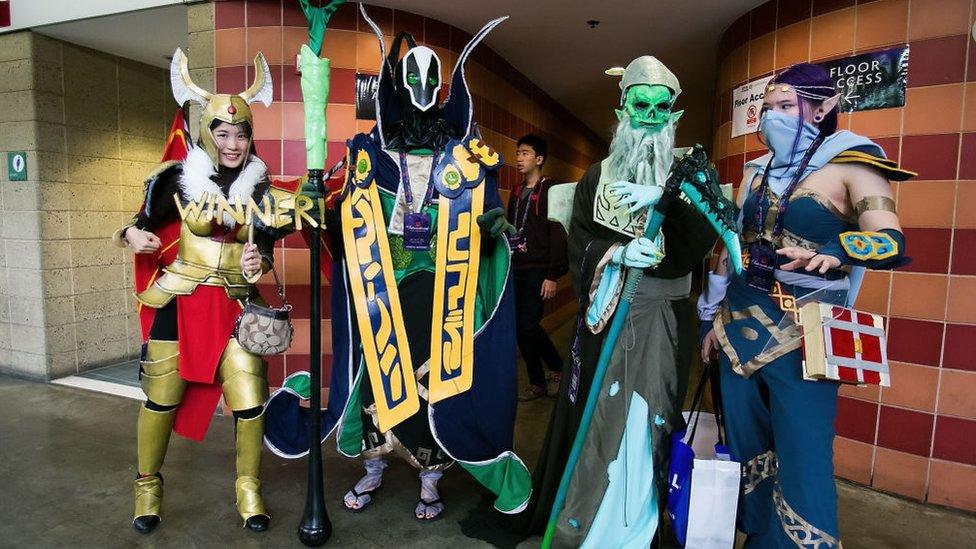 Fans dressed in cosplay pose for a photo at The International DOTA 2 Championships on July 20, 2014 in Seattle, Washington