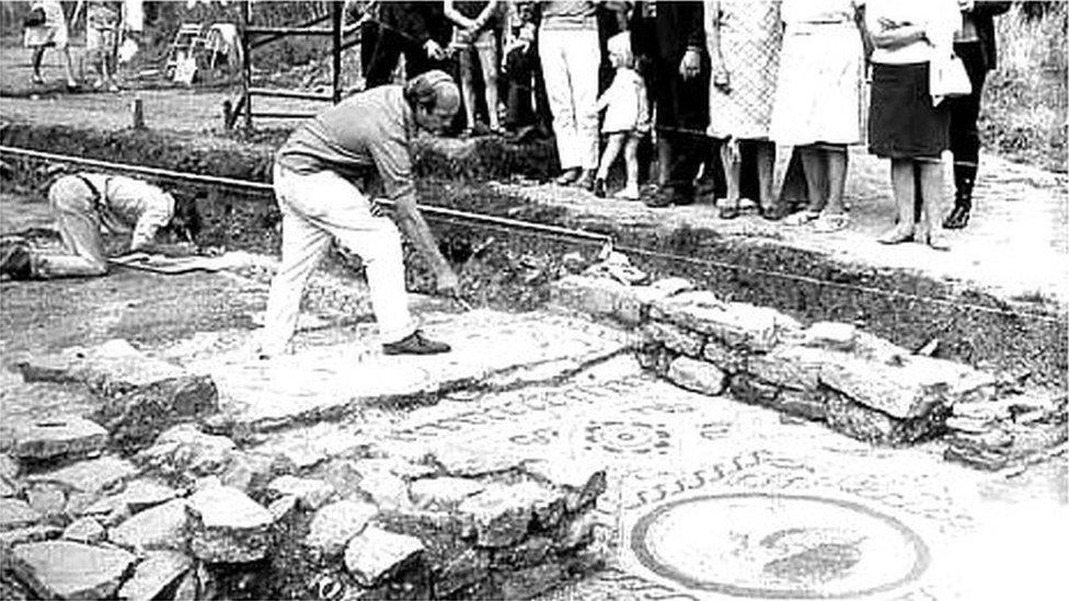 Archaeologist in trench in Cirencester