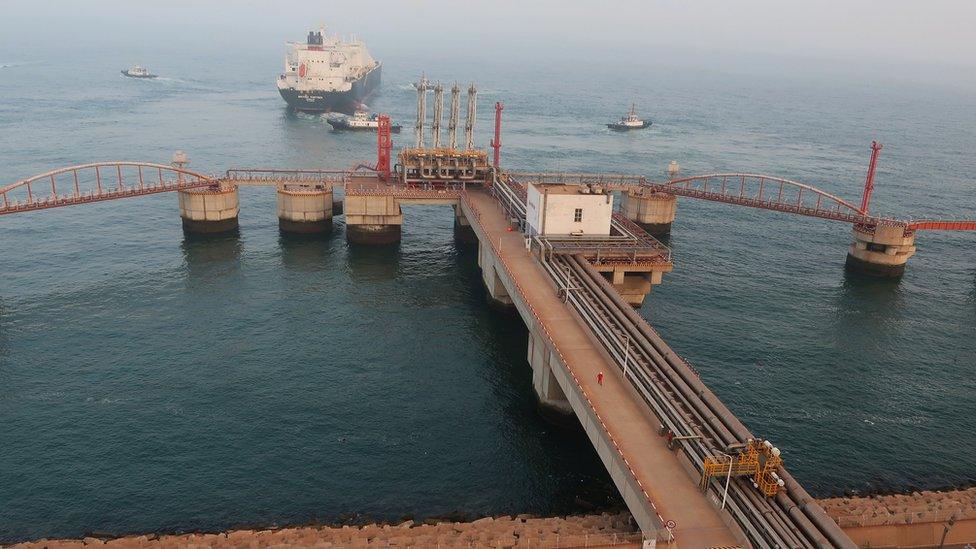 A liquified natural gas (LNG) tanker leaves the dock after discharging at PetroChina"s receiving terminal in Dalian