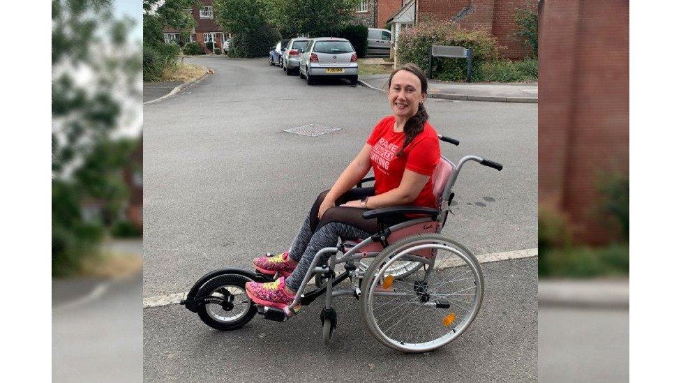 Cat sat in her wheelchair