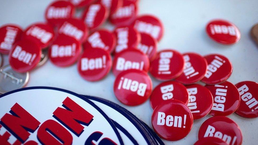 Ben Carson buttons on a table.