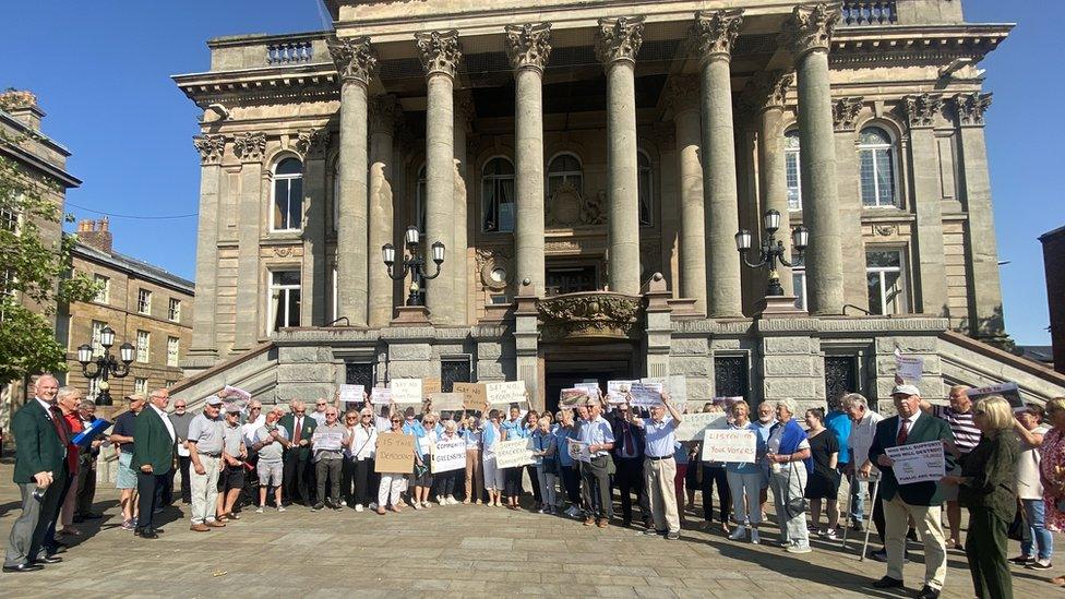 protestors outside Wirral Council