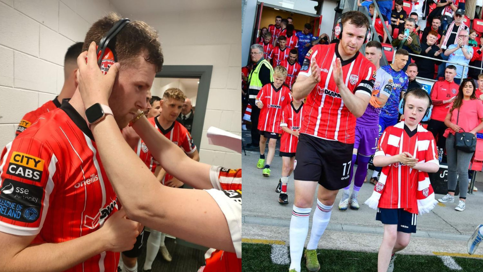 Derry City captain Cameron McJannet wearing ear defenders with young fan