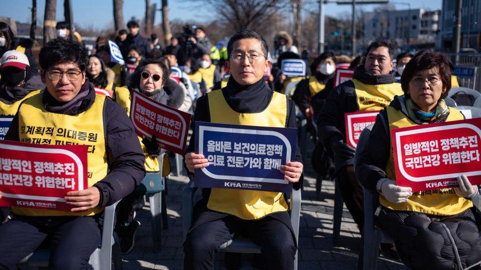 The President of the Korean Medical Association, Lee Pil-Soo (center), and medical personnel affiliated with the Korean Medical Association are chanting slogans at the '1st Rally Strongly Condemning the Hasty Promotion of Increasing Medical School Quotas' in front of the War Memorial of Korea in Seoul, South Korea, on January 25.