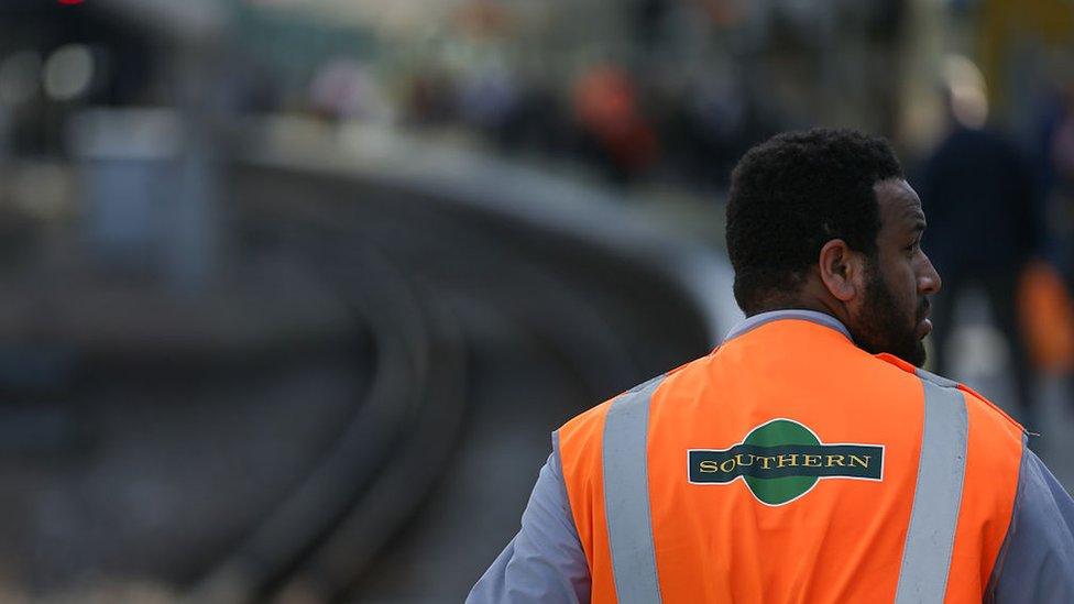 A train conductor as he works on a platform at East Croydon station