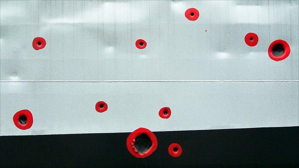 Bullet holes painted red