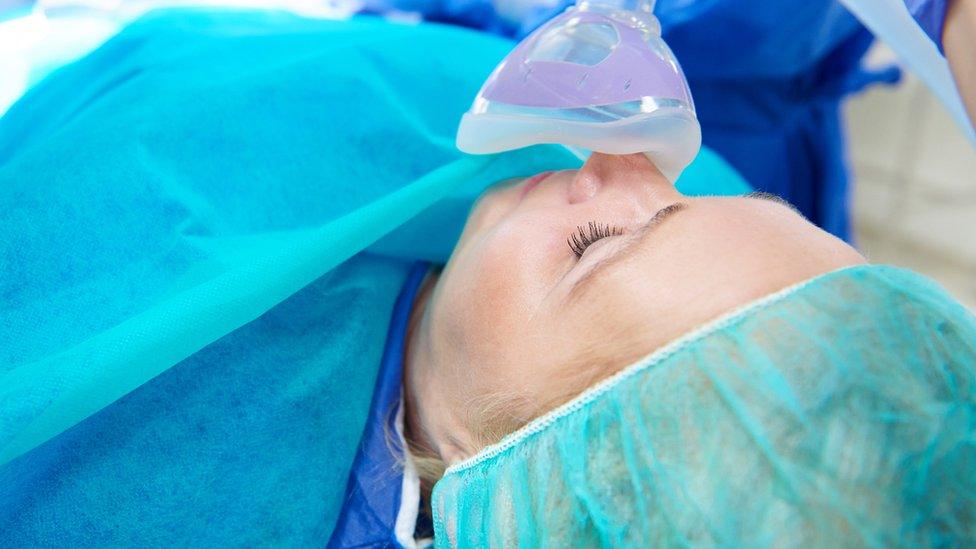 A patient having anaesthetic administered to them