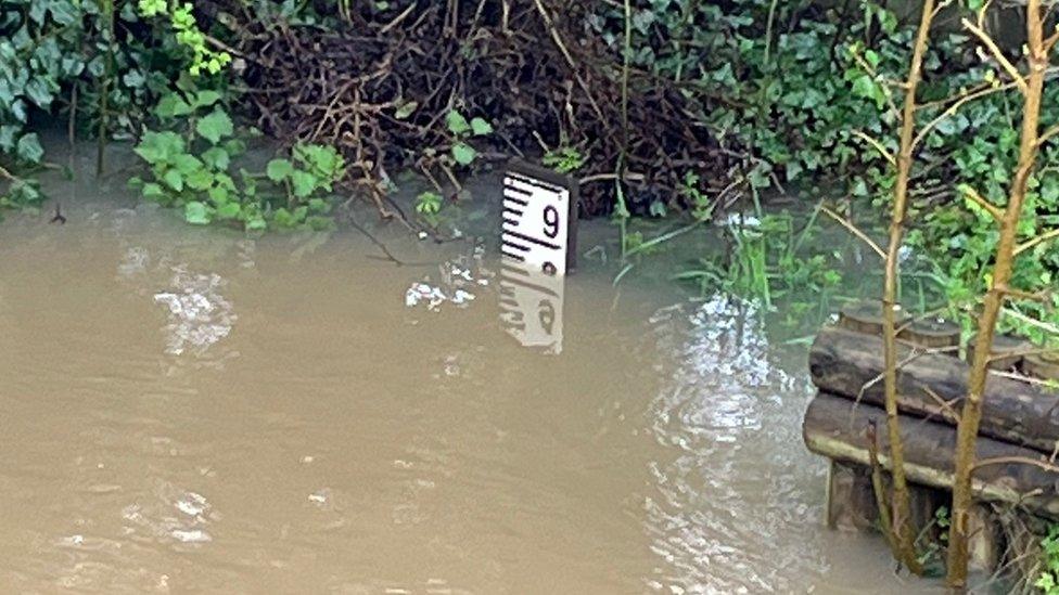 A gauge showing water close to level nine