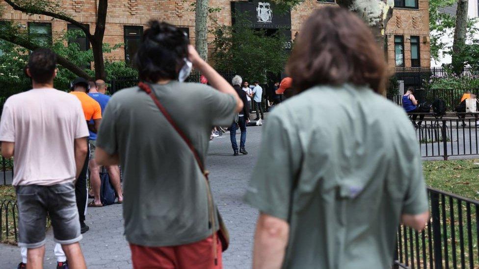 People wait in line to enter the Chelsea Sexual Health Clinic in New York City on 8 July 2022