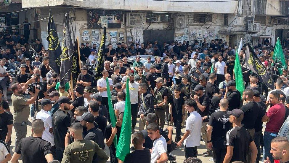 Hamas and Islamic Jihad flags are flown during a funeral procession for one of the four Palestinians killed during an Israeli raid in Jenin refugee gamp, in the occupied West Bank (20 September 2023)