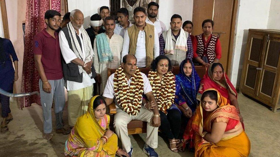 Geeta Lakhan and her husband with their extended family members