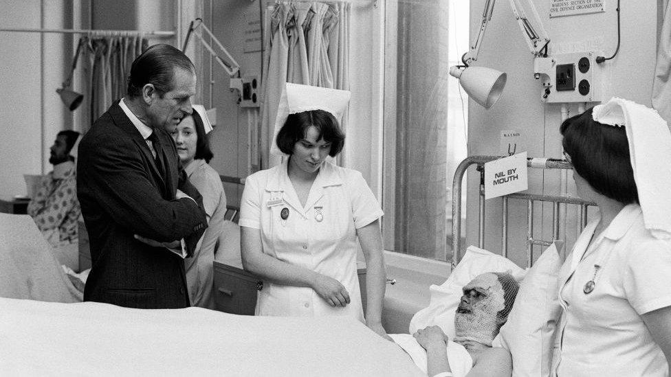 Prince Philip, Duke of Edinburgh, visits victims of the Birmingham Pub Bombings at Birmingham General Hospital, 25th November 1974.