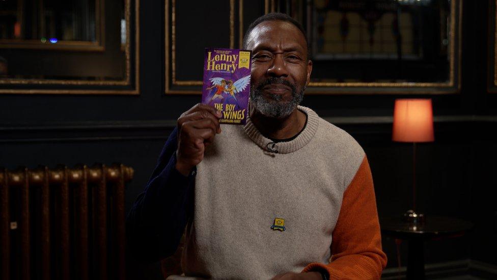 Lenny Henry holds up his £1 World Book Day book