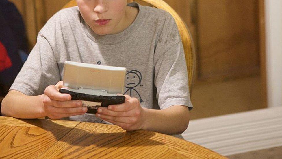 Boy playing video game