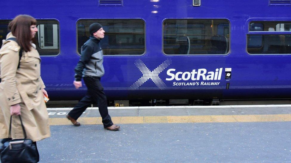 A ScotRail train alongside a platform as rail services continue to attract criticism in the wake of fare increases