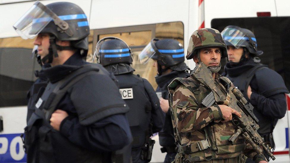 Police forces and soldiers patrol in Saint-Denis, a northern suburb of Paris