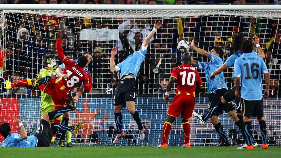 Luis Suarez blocks the ball on the line with his hands against Ghana in 2010