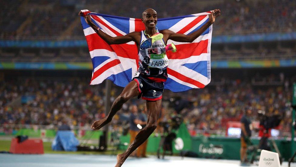 Sir Mo Farah seen jumping in celebration while holding a Union Jack at the Olympic Games in Rio, Brazil in 2016