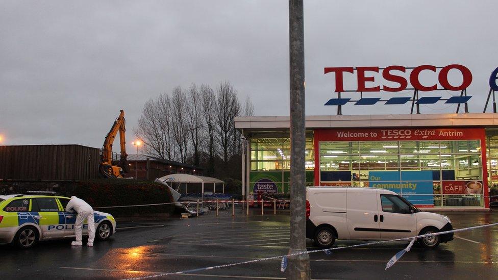 Police at the scene of a theft of cash machines at Tesco Extra in Antrim