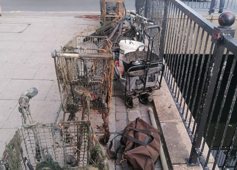 Rusted trolleys pulled from a river