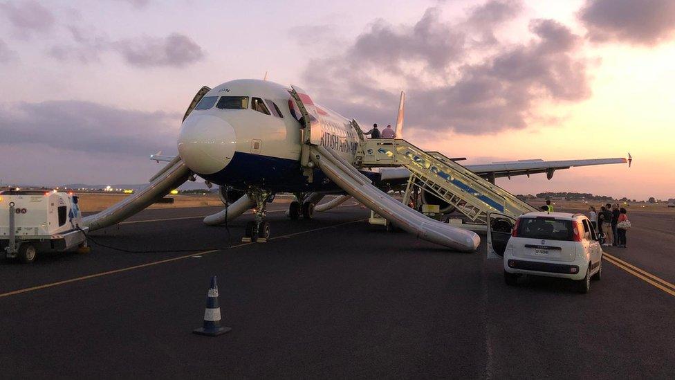 The plane pictured after landing on the runway in Valencia