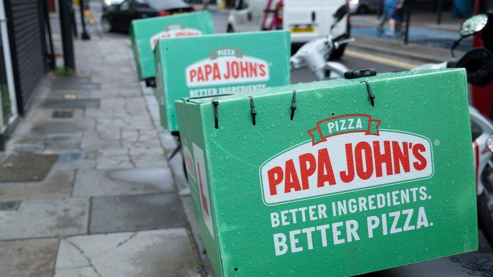 Papa John's delivery boxes strapped to motorcycles in London