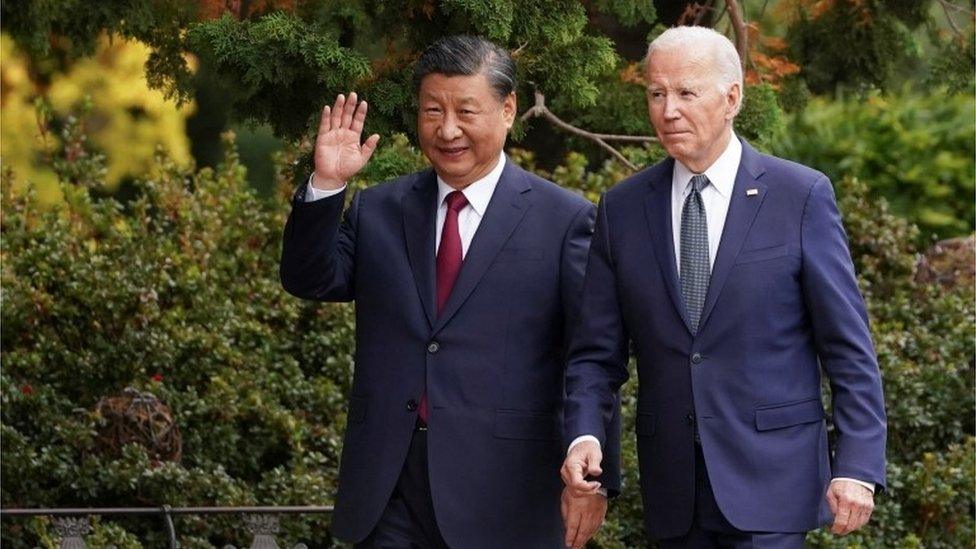 Chinese President Xi Jinping waves as he walks with U.S. President Joe Biden at Filoli estate on the sidelines of the Asia-Pacific Economic Cooperation (APEC) summit, in Woodside, California, U.S., November 15, 2023.