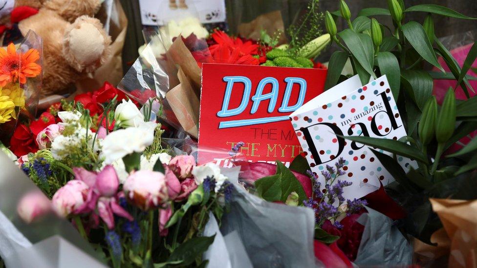 Father's Day cards are among the tributes left for victims of the fire