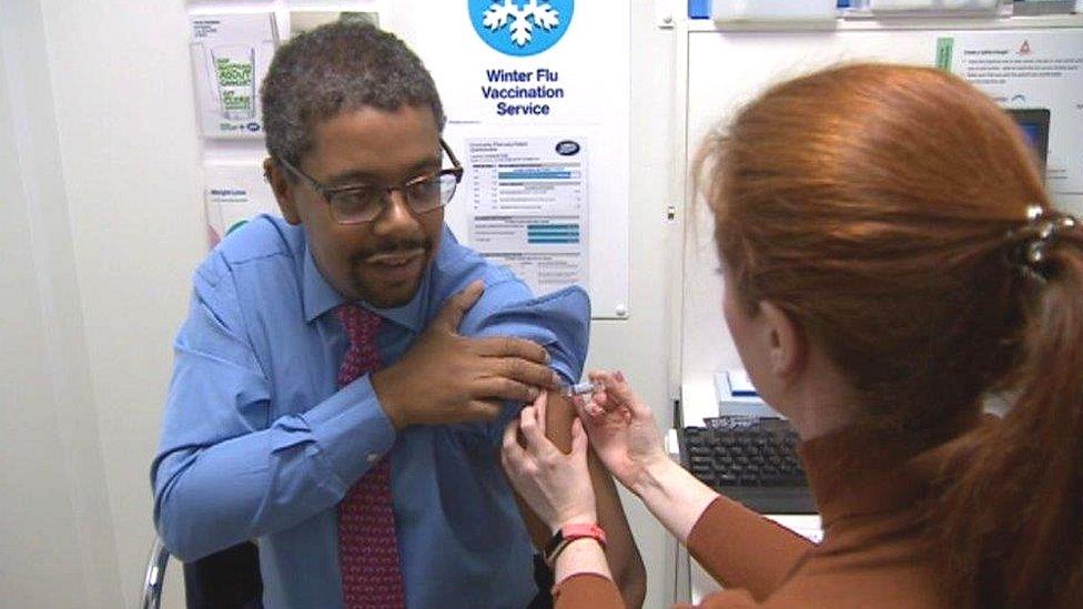 Vaughan Gething receives his jab at a Boots pharmacy in Cwmbran