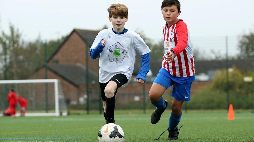 Boys playing football