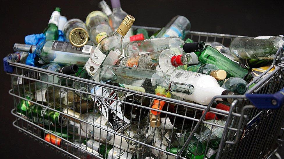 Shopping trolley full of bottles