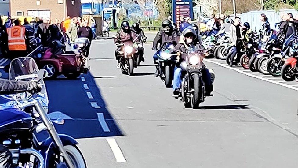 Motorcyclists arrive ready for the convoy