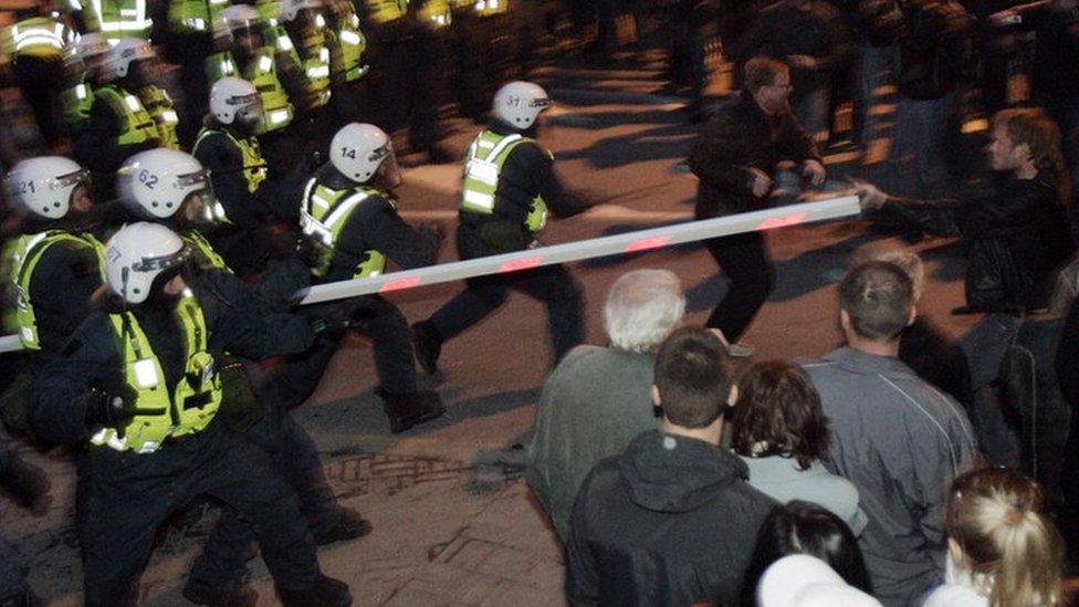 Police face demonstrators 27 April 2007 in Tallin, during a protest against plans to move the Bronze Soldier statue, a Soviet World War II memorial