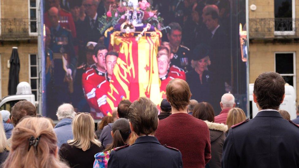 Crowds watching the funeral in Newcastle