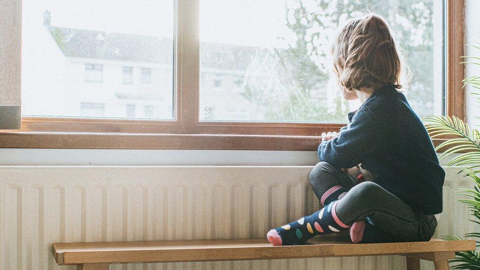 Child looking out of the window