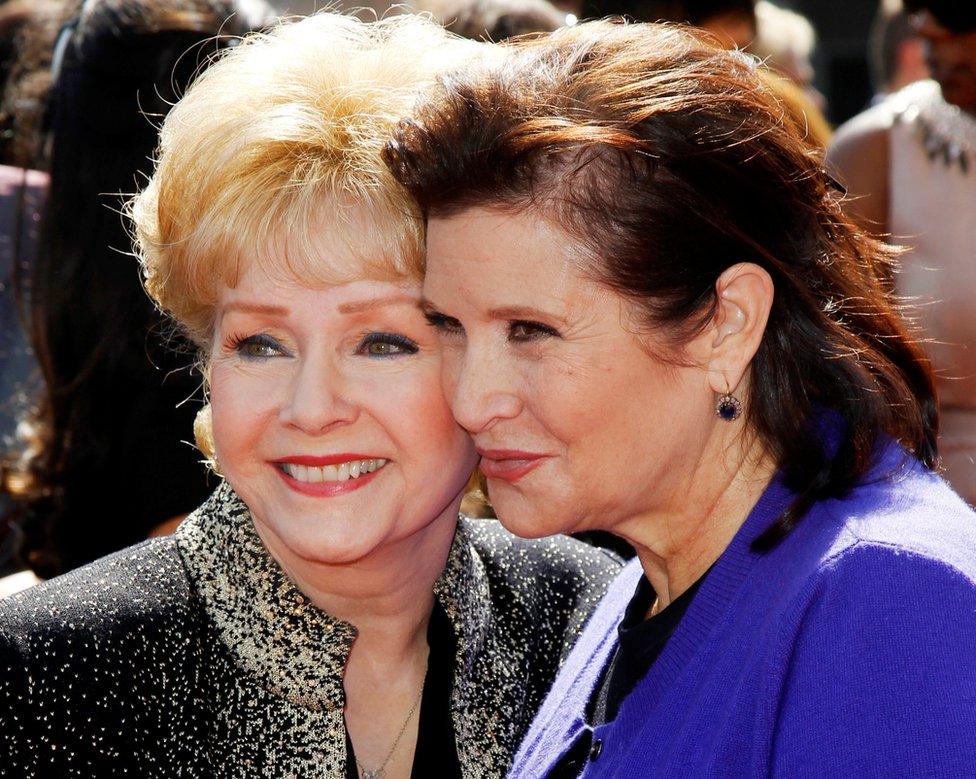 Actress Debbie Reynolds (left) and her daughter Carrie Fisher (right) arrive at the 2011 Primetime Creative Arts Emmy Awards in Los Angeles September 10, 2011.