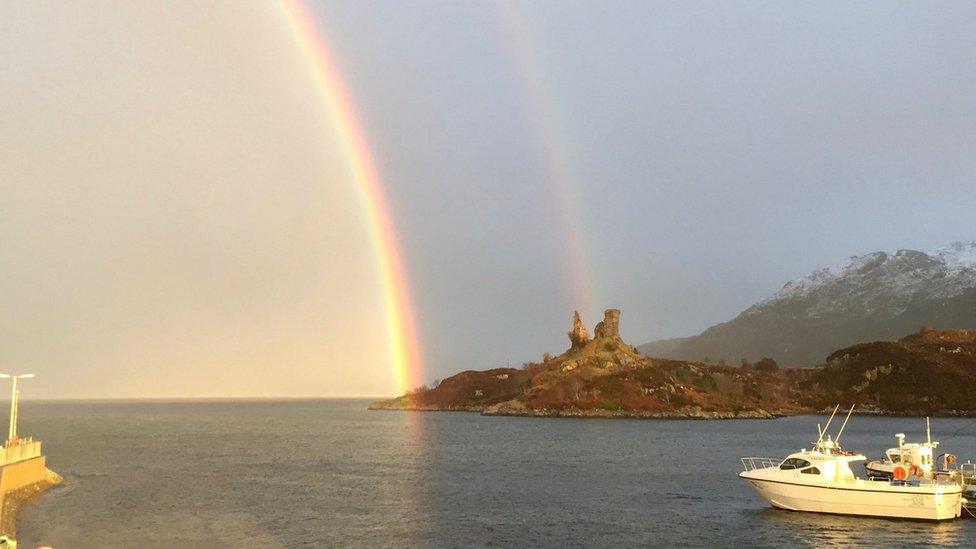 Castle Moil and rainbow before the lightning strike