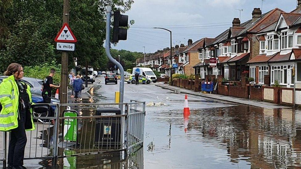 Police have closed roads in Loughton due to flooding